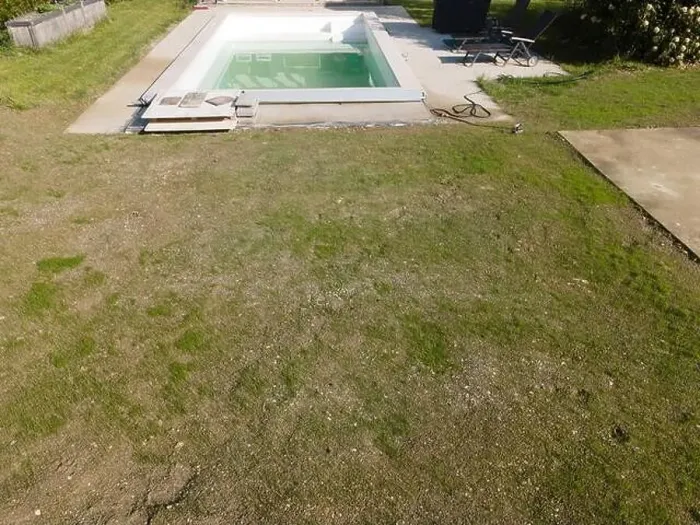 Framed Print : Drone flight over pool in the middle of greenery, fresh grass grown and the pool is not yet cleaned Framed Print : Drone flight over pool in the middle of greenery, fresh grass grown and the pool is not yet cleaned