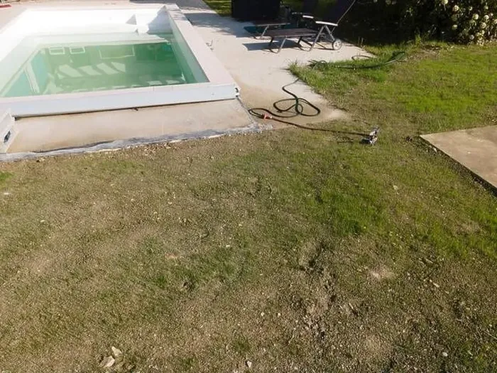 Framed Print : Drone flight over pool in the middle of greenery, fresh grass grown and the pool is not yet cleaned Framed Print : Drone flight over pool in the middle of greenery, fresh grass grown and the pool is not yet cleaned