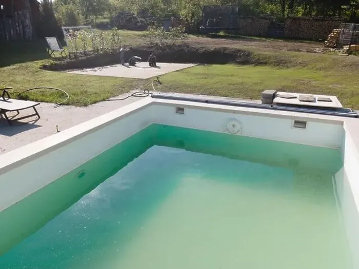Framed Print : Drone flight over pool in the middle of greenery, fresh grass grown and the pool is not yet cleaned Framed Print : Drone flight over pool in the middle of greenery, fresh grass grown and the pool is not yet cleaned
