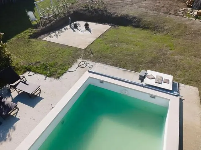 Framed Print : Drone flight over pool in the middle of greenery, fresh grass grown and the pool is not yet cleaned Framed Print : Drone flight over pool in the middle of greenery, fresh grass grown and the pool is not yet cleaned
