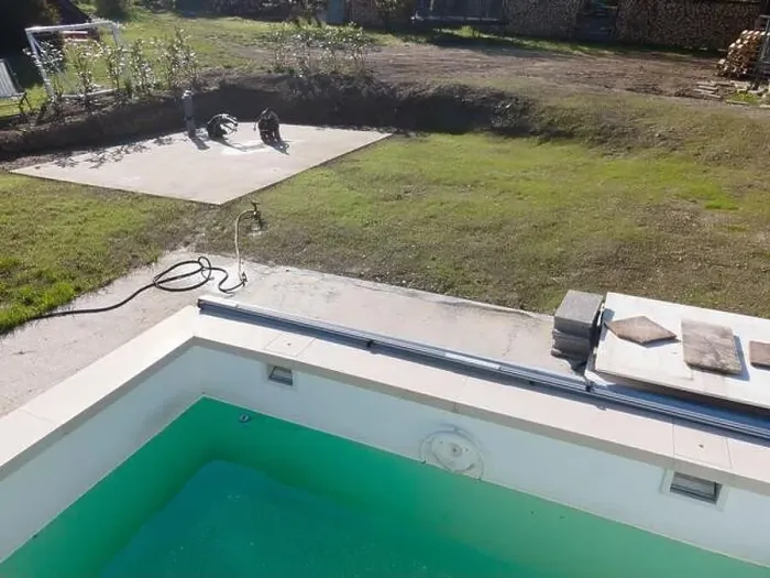 Framed Print : Drone flight over pool in the middle of greenery, fresh grass grown and the pool is not yet cleaned Framed Print : Drone flight over pool in the middle of greenery, fresh grass grown and the pool is not yet cleaned