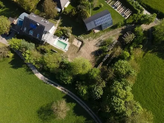 Framed Print : Drone flight over pool in the middle of greenery, fresh grass grown and the pool is not yet cleaned Framed Print : Drone flight over pool in the middle of greenery, fresh grass grown and the pool is not yet cleaned