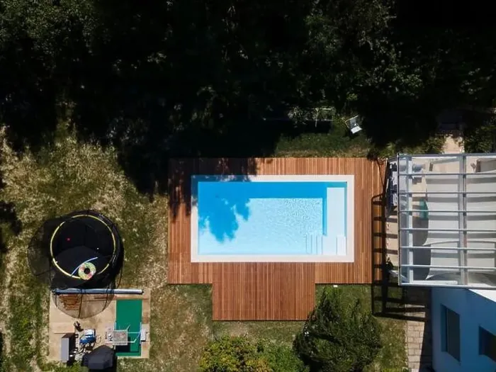 Framed Print : Drone flight over pool with nice wooden terrace surrounded by green lawn in beautiful garden Framed Print : Drone flight over pool with nice wooden terrace surrounded by green lawn in beautiful garden
