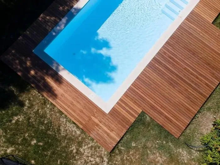 Framed Print : Drone flight over pool with nice wooden terrace surrounded by green lawn in beautiful garden Framed Print : Drone flight over pool with nice wooden terrace surrounded by green lawn in beautiful garden