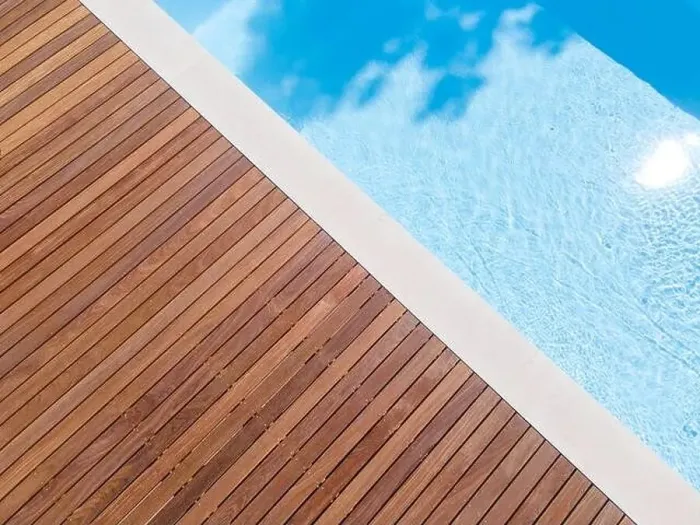 Framed Print : Drone flight over pool with nice wooden terrace surrounded by green lawn in beautiful garden
