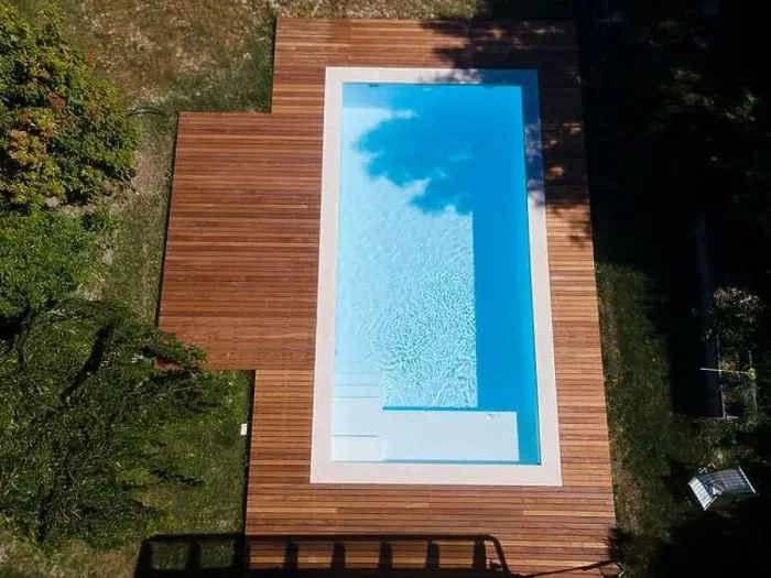 Framed Print : Drone flight over pool with nice wooden terrace surrounded by green lawn in beautiful garden Framed Print : Drone flight over pool with nice wooden terrace surrounded by green lawn in beautiful garden