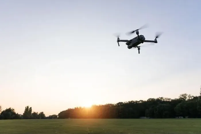 Framed Print : Drone flying over landscape. UAV drone copter flying with digital camera Framed Print : Drone flying over landscape. UAV drone copter flying with digital camera
