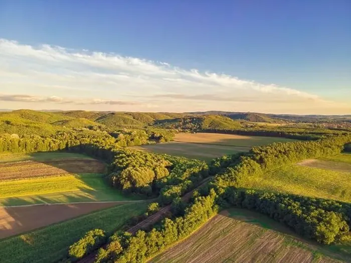 Framed Print : Drone footage of hills, fields and a railway line running through the trees, Balassagyarmat, Hungary Framed Print : Drone footage of hills, fields and a railway line running through the trees, Balassagyarmat, Hungary