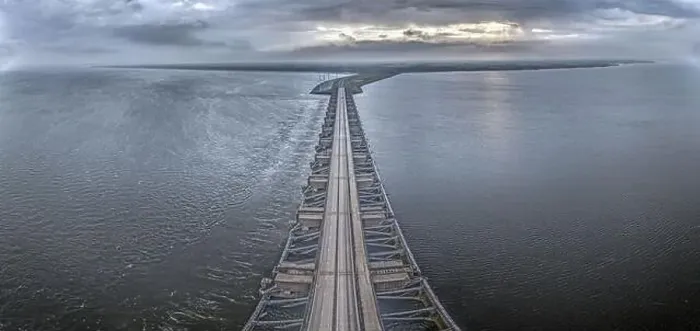Framed Print : Drone image over the Haringvlietdam flood barrier near the Dutch town of Ouddorp against a cloudy morning sky Framed Print : Drone image over the Haringvlietdam flood barrier near the Dutch town of Ouddorp against a cloudy morning sky