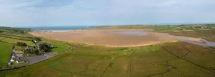 Framed Print : A drone panorama landscape of North Lacken with a view of the beach and saltmarsh at low tide Framed Print : A drone panorama landscape of North Lacken with a view of the beach and saltmarsh at low tide