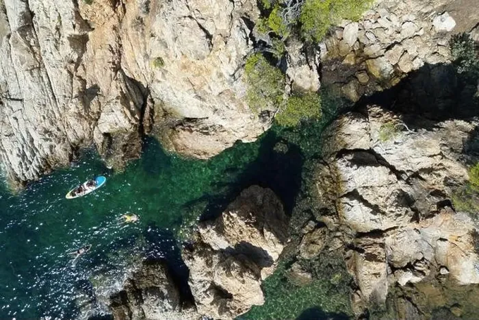 Framed Print : Drone photo looking down on swimmers in a rocky Cove in the South of France Framed Print : Drone photo looking down on swimmers in a rocky Cove in the South of France