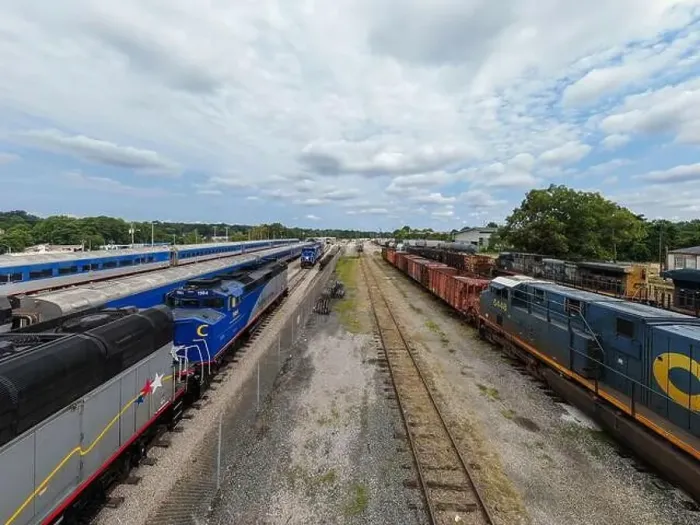 Framed Print : drone photos of various rail cars and amtrak trains on a cloudy day in downtown raleigh north carolina Framed Print : drone photos of various rail cars and amtrak trains on a cloudy day in downtown raleigh north carolina