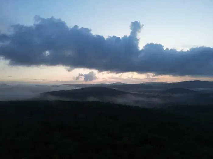 Framed Print : Drone picture of a foggy valley with rolling hills during sunset Framed Print : Drone picture of a foggy valley with rolling hills during sunset