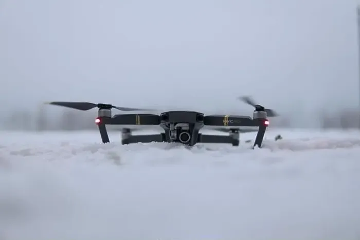 Framed Print : Drone Ready for Takeoff on Snowy Ground in Winter Landscape Framed Print : Drone Ready for Takeoff on Snowy Ground in Winter Landscape