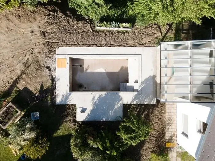 Framed Print : Drone shot of pool construction site in a garden, earth around the pool is already backfilled Framed Print : Drone shot of pool construction site in a garden, earth around the pool is already backfilled