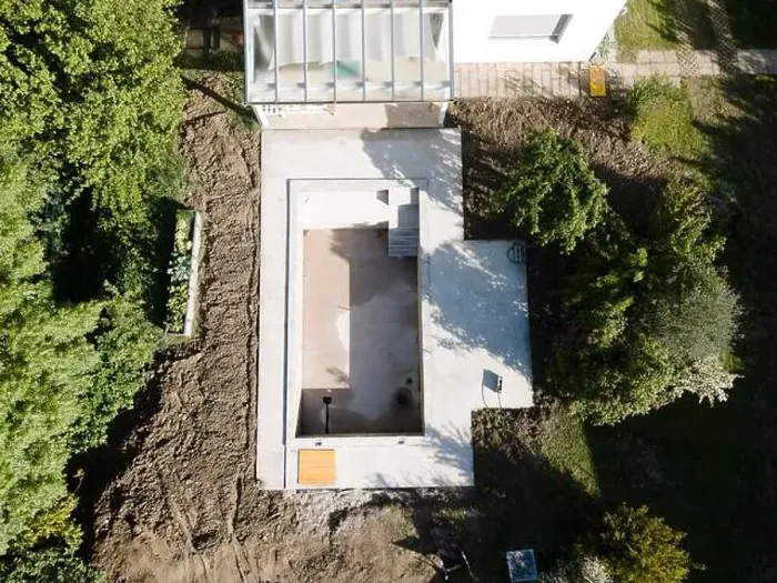 Framed Print : Drone shot of pool construction site in a garden, earth around the pool is already backfilled Framed Print : Drone shot of pool construction site in a garden, earth around the pool is already backfilled