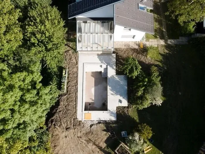 Framed Print : Drone shot of pool construction site in a garden, earth around the pool is already backfilled Framed Print : Drone shot of pool construction site in a garden, earth around the pool is already backfilled
