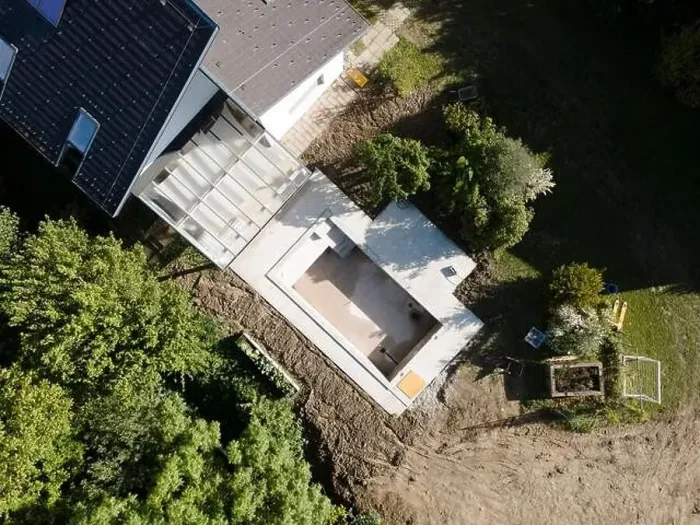 Framed Print : Drone shot of pool construction site in a garden, earth around the pool is already backfilled Framed Print : Drone shot of pool construction site in a garden, earth around the pool is already backfilled