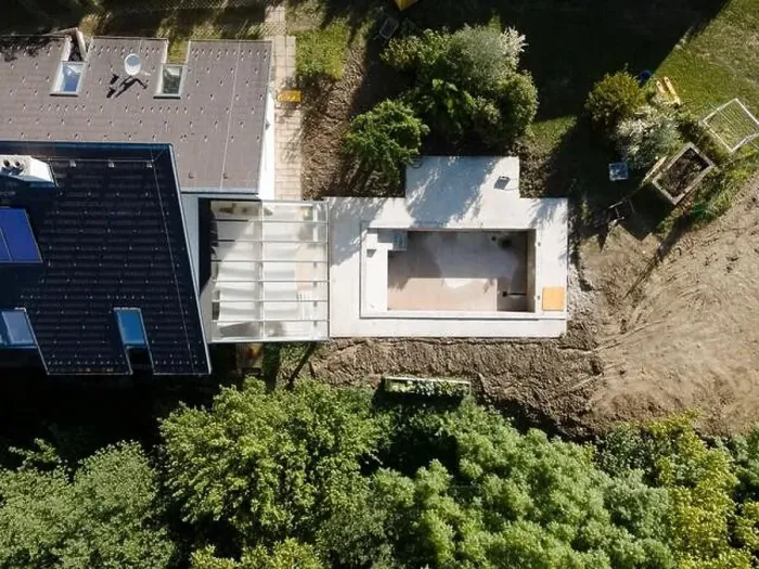 Framed Print : Drone shot of pool construction site in a garden, earth around the pool is already backfilled