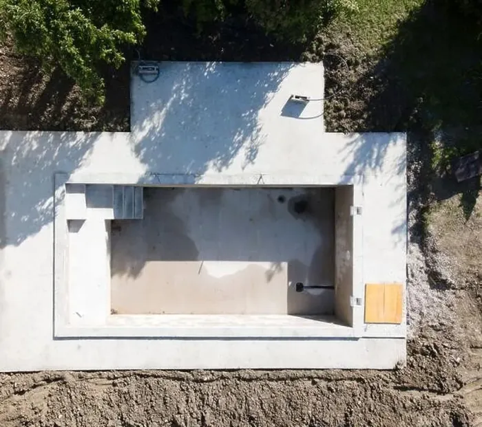 Framed Print : Drone shot of pool construction site in a garden, earth around the pool is already backfilled Framed Print : Drone shot of pool construction site in a garden, earth around the pool is already backfilled