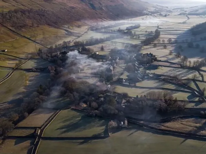 Framed Print : Drone shot shows morning Mist and smoke from a chimney float above yorkshire dales village of arncliffe Framed Print : Drone shot shows morning Mist and smoke from a chimney float above yorkshire dales village of arncliffe