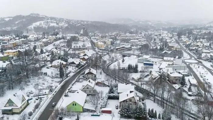 Framed Print : Drone shot of a small town named Limanowa in mountains in Poland covered with fog and snow Framed Print : Drone shot of a small town named Limanowa in mountains in Poland covered with fog and snow
