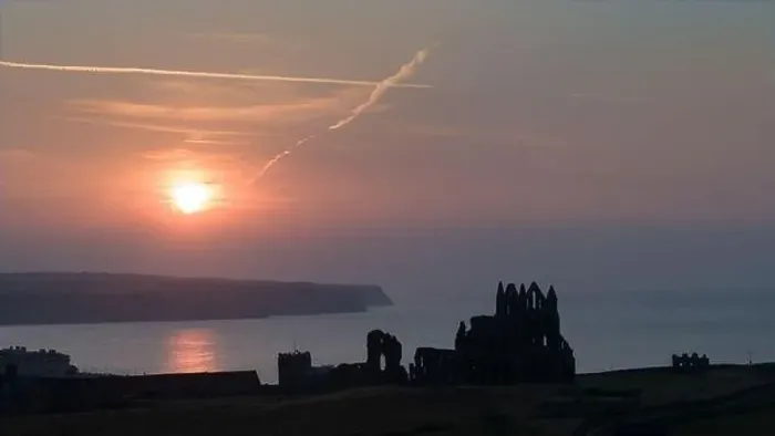 Framed Print : Drone shot of a sunset over Whitby Abbey, North Yorkshire Framed Print : Drone shot of a sunset over Whitby Abbey, North Yorkshire