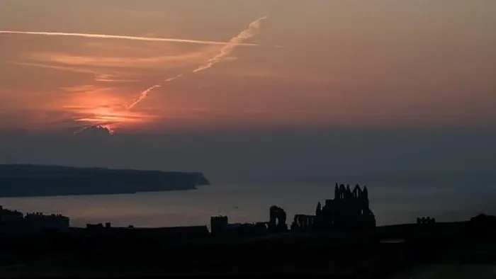 Framed Print : Drone shot of a sunset over Whitby Abbey, North Yorkshire Framed Print : Drone shot of a sunset over Whitby Abbey, North Yorkshire