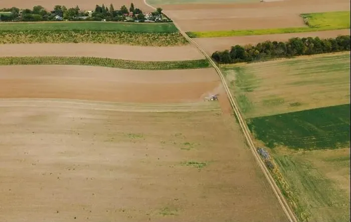 Framed Print : Drone view down on agriculture crop land with wheat fields Vineyards and Tractor