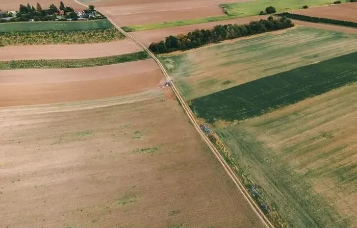 Framed Print : Drone view down on agriculture crop land with wheat fields Vineyards and Tractor Framed Print : Drone view down on agriculture crop land with wheat fields Vineyards and Tractor