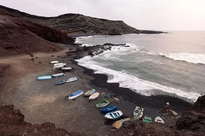 Framed Print : Drone view of boats on Ciclos Beach against foamy ocean Framed Print : Drone view of boats on Ciclos Beach against foamy ocean