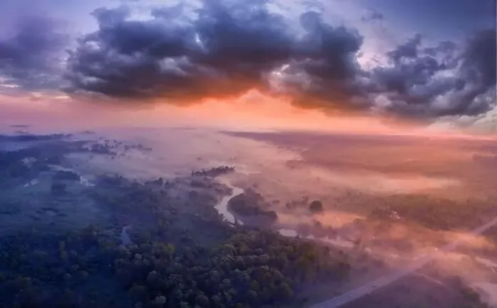 Framed Print : Drone view of the bright dawn over the highway overpass, forest and misty meadow