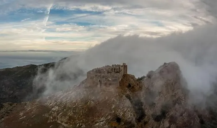 Framed Print : Drone view of the Castello del Volterraio shrouded in morning fog and cloud Framed Print : Drone view of the Castello del Volterraio shrouded in morning fog and cloud
