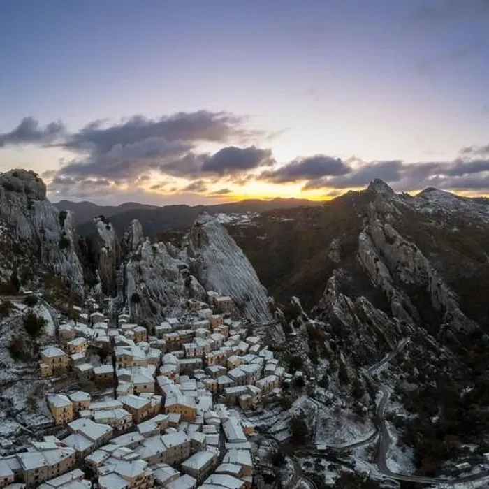 Framed Print : A drone view of Castelmezzano at sunrise in winter Framed Print : A drone view of Castelmezzano at sunrise in winter
