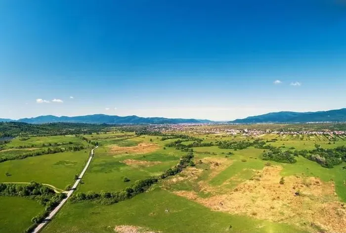 Framed Print : Drone view of the countryside. Road, meadows, and the village in the foothills of the Carpathians Framed Print : Drone view of the countryside. Road, meadows, and the village in the foothills of the Carpathians