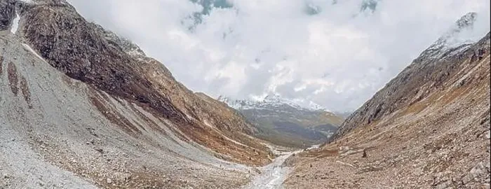 Framed Print : drone view over a desolate receding alpine glacier surrounded by mountains and snow covered rocks and peaks Framed Print : drone view over a desolate receding alpine glacier surrounded by mountains and snow covered rocks and peaks