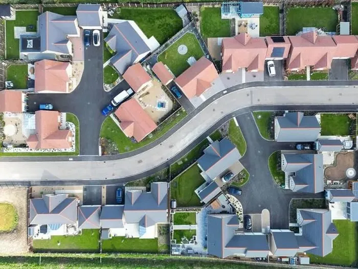 Framed Print : Drone top down view of detached bungalows seen at a new housing development in the English countryside Framed Print : Drone top down view of detached bungalows seen at a new housing development in the English countryside