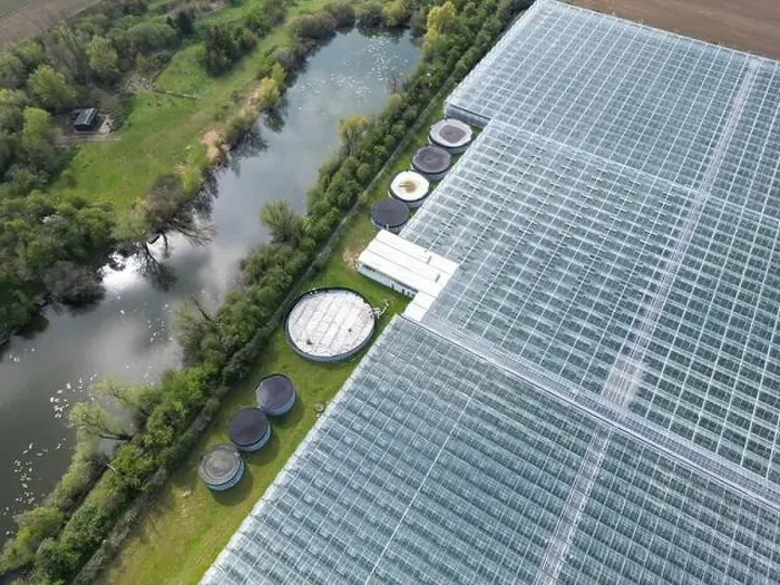 Framed Print : Drone view of a part of a huge commercial glass house growing young plants Framed Print : Drone view of a part of a huge commercial glass house growing young plants