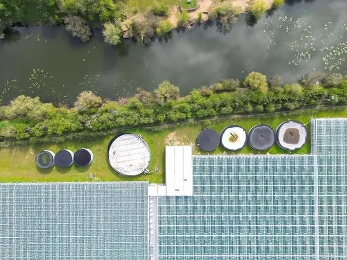 Framed Print : Drone view of a part of a huge commercial glass house growing young plants Framed Print : Drone view of a part of a huge commercial glass house growing young plants