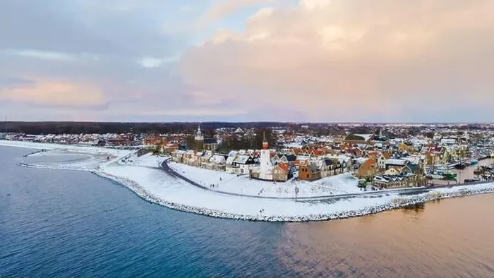 Framed Print : Drone view of the Lighthouse of Urk during winter with snow landscape in the Netherlands Framed Print : Drone view of the Lighthouse of Urk during winter with snow landscape in the Netherlands