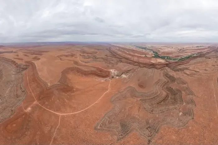 Framed Print : Drone view of meandering Rio San Juan cutting through the rugged landscapes of San Juan Canyon near Mexican Hat