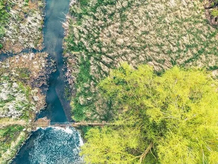 Framed Print : Drone top down view of a very old river crossing now covered with grass. The fresh water river is famous for salmon Framed Print : Drone top down view of a very old river crossing now covered with grass. The fresh water river is famous for salmon