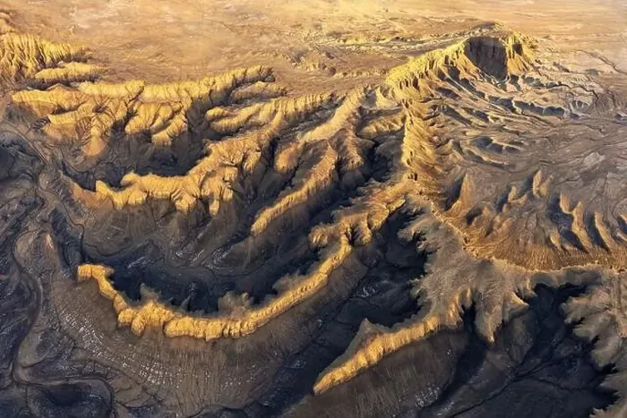 Framed Print : From above drone view of picturesque scenery with rough rocky formations and dry land in North Caineville Mesa Framed Print : From above drone view of picturesque scenery with rough rocky formations and dry land in North Caineville Mesa
