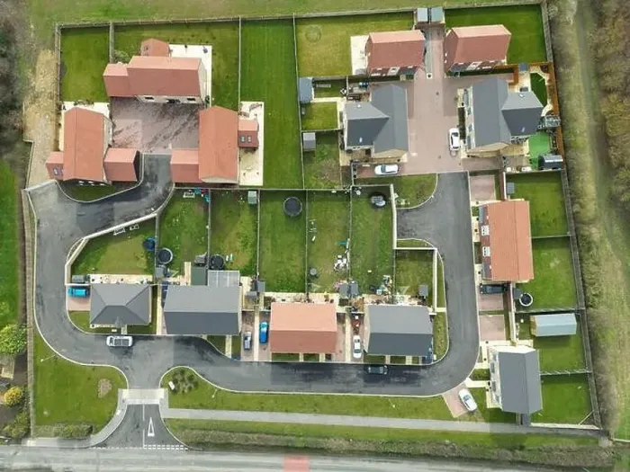 Framed Print : Top down drone view of a small housing development at the edge of an East Anglian village Framed Print : Top down drone view of a small housing development at the edge of an East Anglian village