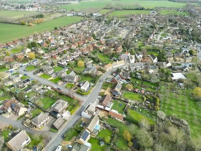 Framed Print : Drone view of a sprawling East Anglian village showing the main roadway leading through the bottom left of the image Framed Print : Drone view of a sprawling East Anglian village showing the main roadway leading through the bottom left of the image