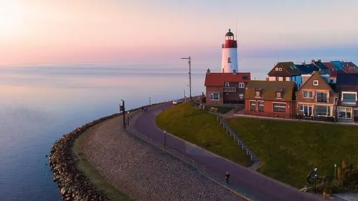 Framed Print : Drone view at Urk Flevoland Netherlands sunset at the lighthouse and harbor of Urk Holland