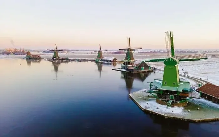 Framed Print : Drone view at the Zaanse Schans windmill village during winter with snow in the Netherlands