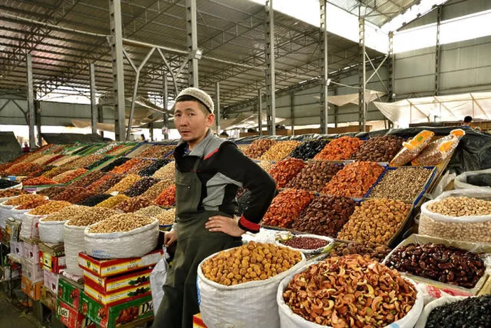 Framed Print : Dry fruit vendor at Osh Bazar, Central Asia's oldest and largest market Framed Print : Dry fruit vendor at Osh Bazar, Central Asia's oldest and largest market