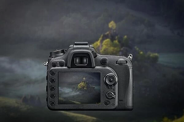 DSLR reflex camera photographing with on screen live image of mountain landscape at sunrise with fog Morning sunshine with fog o