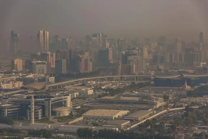 Framed Print : DUBAI, UAE - APRIL 29: Aerial view of Downtown Dubai and skyscrapers during morning sandstorm. Highway and trainline, soft light over the sand